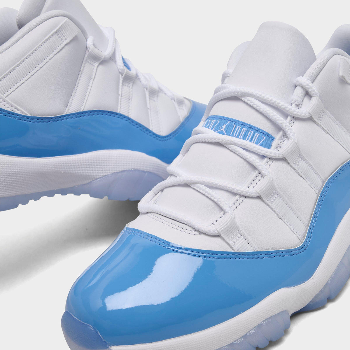 Men's Air Jordan Retro 11 Low Basketball Shoes - White/University Blue/Black - view 3